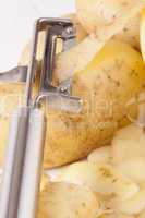Potatoes with Peeler and Peeled Skin