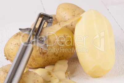 Potatoes with Peeler and Peeled Skin