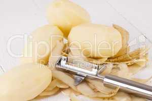 Potatoes with Peeler and Peeled Skin