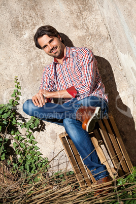 Male model sitting with legs crossed