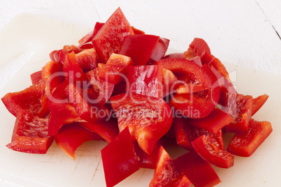 Pile of Chopped Red Pepper on Cutting Board