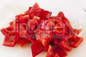 Pile of Chopped Red Pepper on Cutting Board