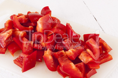 Pile of Chopped Red Pepper on Cutting Board
