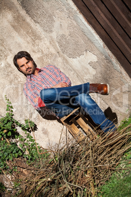 Male model sitting with legs crossed