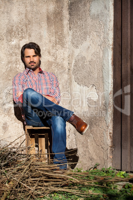 Male model sitting with legs crossed