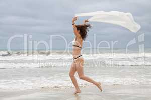 brunette attractive woman carefree on beach summer freedom
