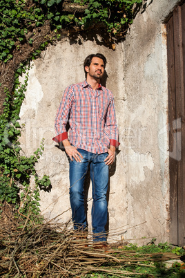 Male model sitting with legs crossed