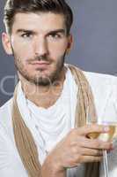 Sexy handsome man drinking white wine