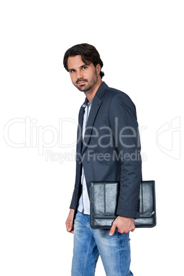 Handsome stylish man carrying a briefcase