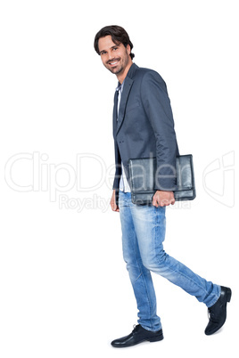 Handsome stylish man carrying a briefcase