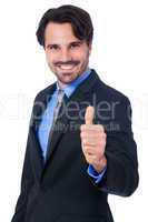 Enthusiastic businessman giving a thumbs up