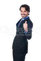 Enthusiastic businessman giving a thumbs up