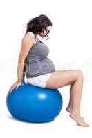 Pregnant woman doing pilates exercises