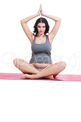 Pregnant woman practising yoga and meditating