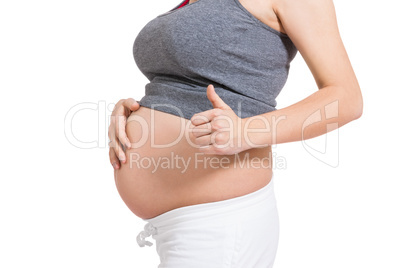 Pregnant woman giving a thumbs up gesture