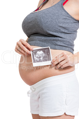 Pregnant woman displaying a prenatal ultrasound