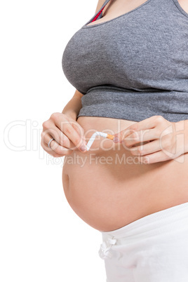 Pregnant woman breaking a cigarette in two