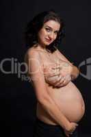 Pregnant woman posing nude