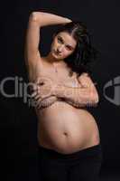 Pregnant woman posing nude