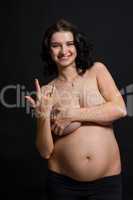 Pregnant woman posing nude