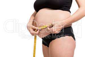 Pregnant woman measuring her abdomen