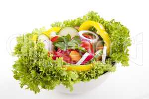 fresh tasty mixed salad with different vegetables isolated