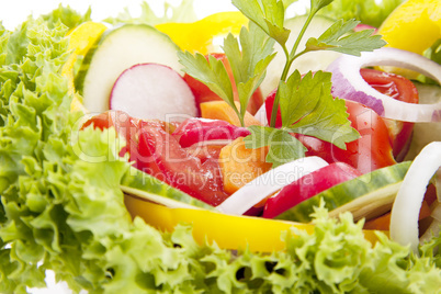 fresh tasty mixed salad with different vegetables isolated