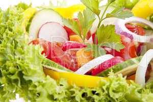 fresh tasty mixed salad with different vegetables isolated