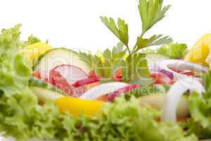 fresh tasty mixed salad with different vegetables isolated