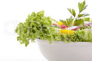 fresh tasty mixed salad with different vegetables isolated