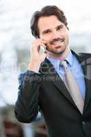 Businessman listening to a call on his mobile