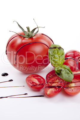 fresh red tomatoes with balsamic and oilve oil isolated