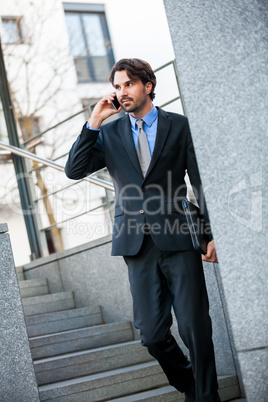 Businessman listening to a call on his mobile