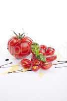 fresh red tomatoes with balsamic and oilve oil isolated