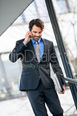 Businessman listening to a call on his mobile