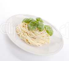 fresh delicious pasta with basil isolated on white