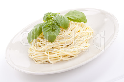 fresh delicious pasta with basil isolated on white
