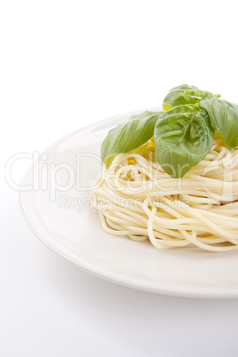 fresh delicious pasta with basil isolated on white