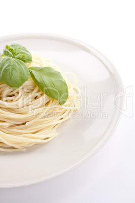 fresh delicious pasta with basil isolated on white