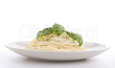 fresh delicious pasta with basil isolated on white