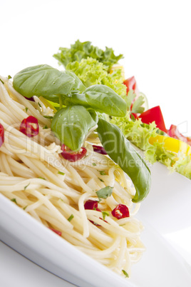 fresh pasta with chilli and basil isolated