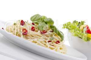 fresh pasta with chilli and basil isolated