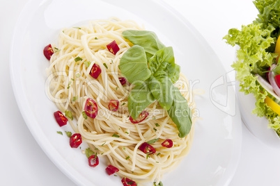 fresh pasta with chilli and basil isolated