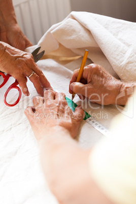 Hand Cutting Cloth with Scissors