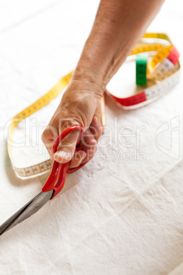 Hand Cutting Cloth with Scissors