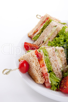 fresh tasty club sandwich with salad and toast isolated