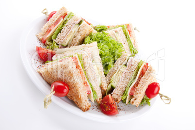 fresh tasty club sandwich with salad and toast isolated