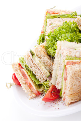 fresh tasty club sandwich with salad and toast isolated