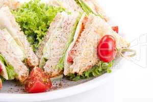 fresh tasty club sandwich with salad and toast isolated