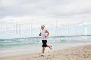 man is jogging on the beach summertime sport fitness